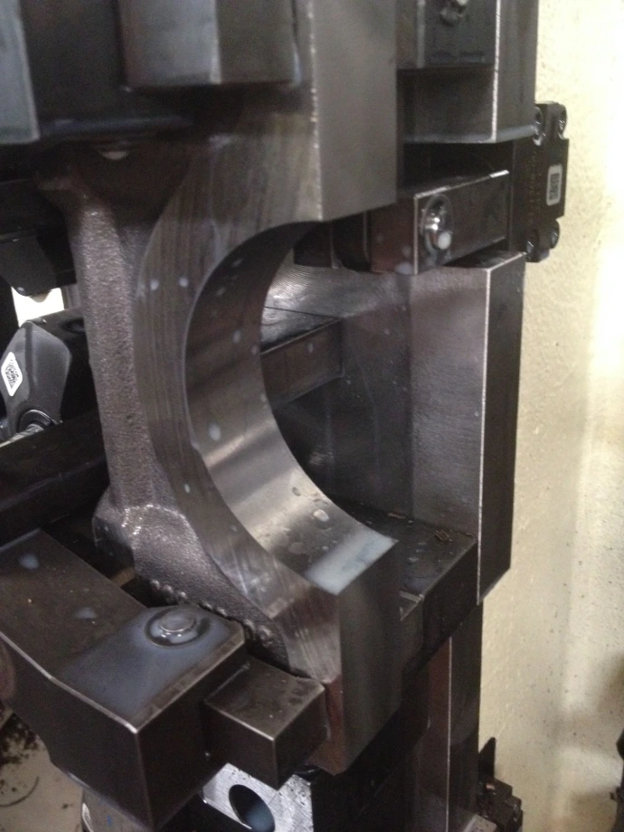 Engine cap machining operation